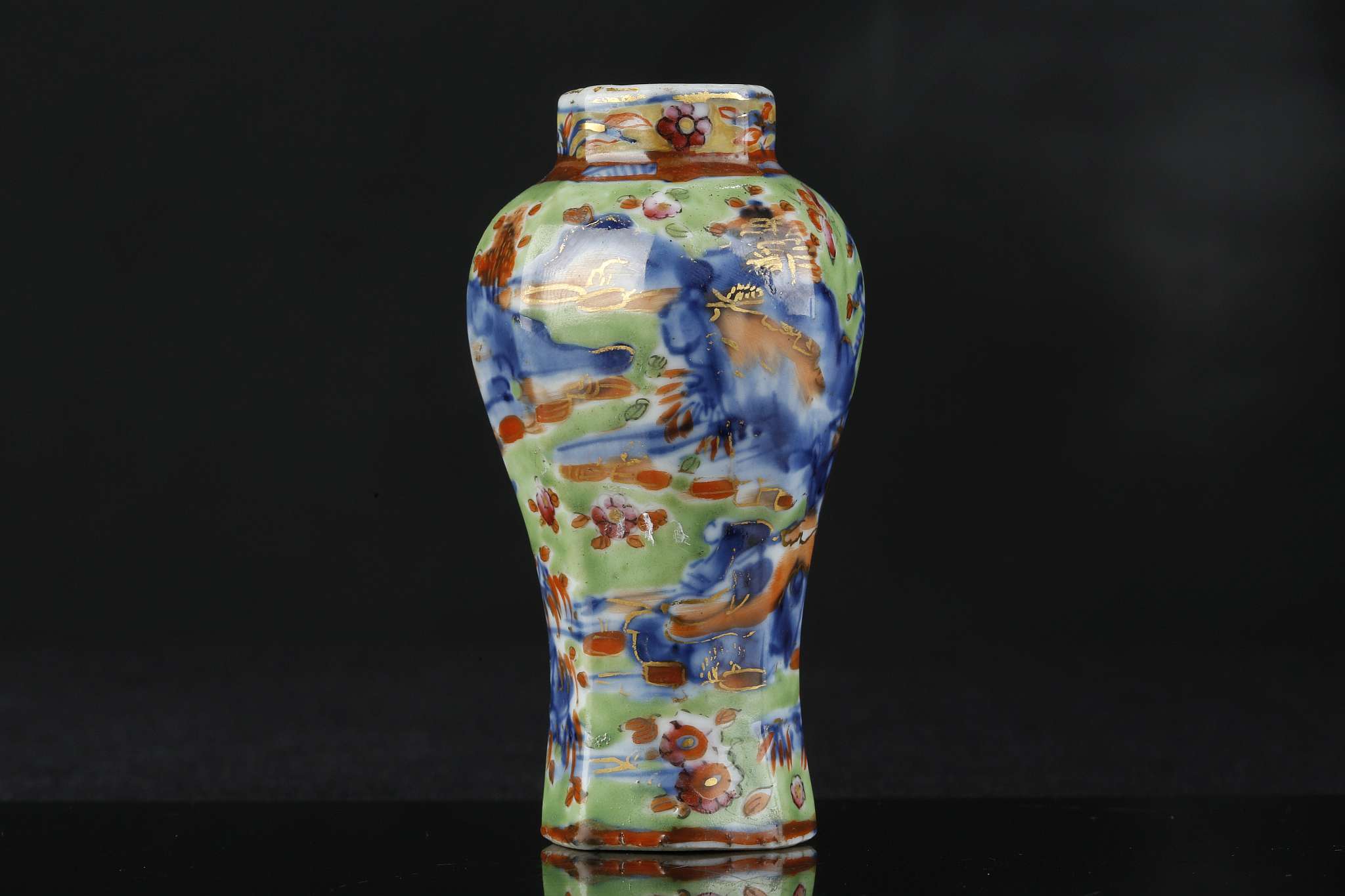 A CHINESE CLOBBERED MINIATURE BLUE AND WHITE VASE.
Qing Dynasty.
Of octagonal section, decorated - Image 4 of 6