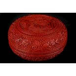 A CHINESE CARVED CINNABAR LACQUER CIRCULAR BOX AND COVER.
Qing Dynasty, Qianlong period.
The