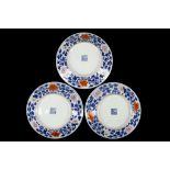 A SET OF THREE CHINESE ENAMELLED BLUE AND WHITE PLATES.
Qing Dynasty, Qianlong mark and of the