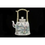 A CHINESE FIGURATIVE FAMILLE VERTE TEAPOT AND COVE