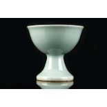 A CHINESE CELADON STEM CUP.
Late Qing Dynasty.
With a slightly everted rim, standing on a high foot,