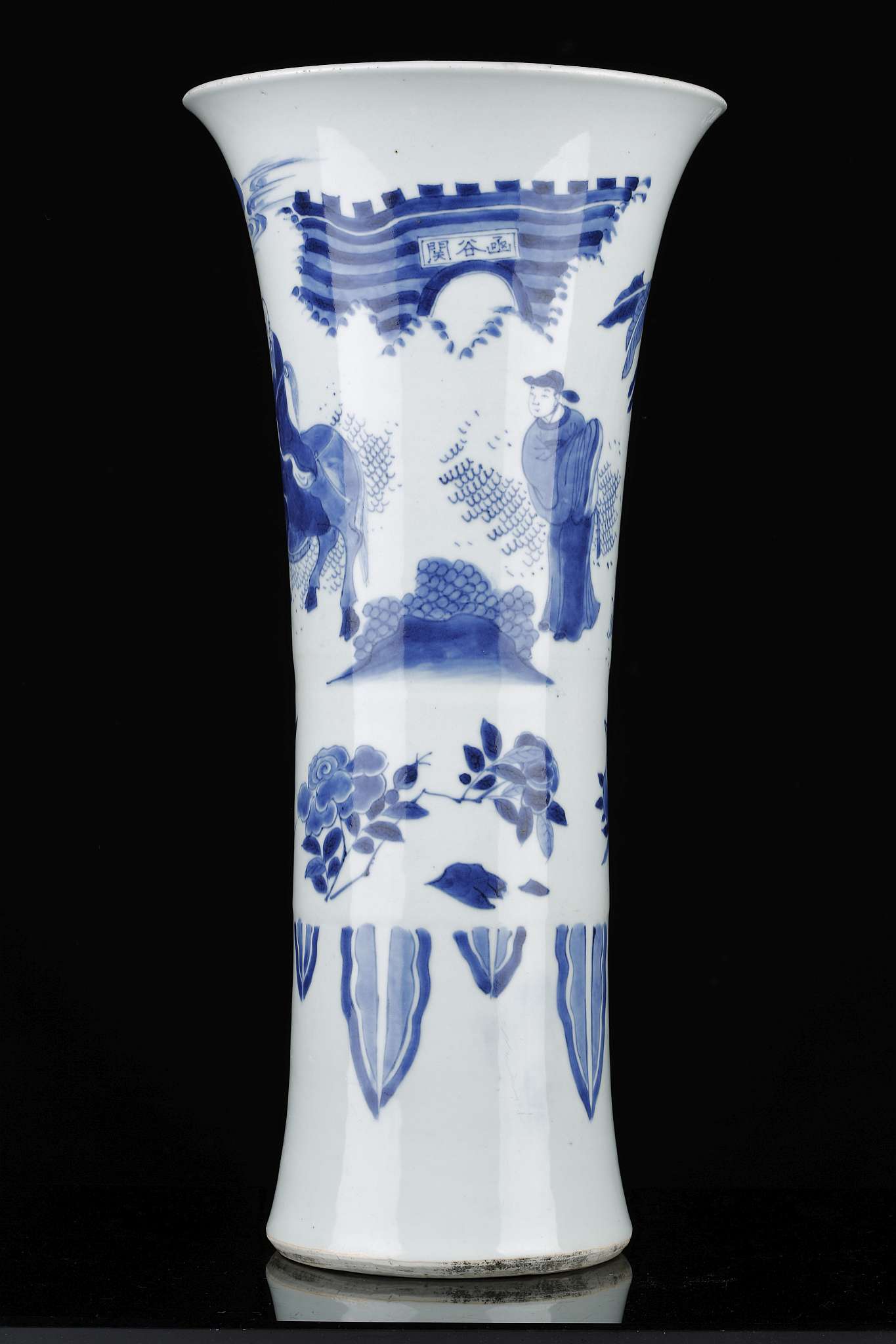 A CHINESE TRANSITIONAL BLUE AND WHITE VASE, GU.
Transitional Period, c. 1690.
With a flaring rim,