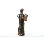 A CHINESE GILT BRONZE FIGURE OF A STANDING LADY.
Ming Dynasty.
Naturalistically cast with the left