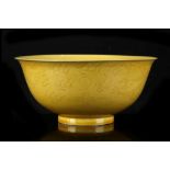 A CHINESE YELLOW-GLAZED INCISED ‘DRAGON’ BOWL.
Late Qing Dynasty.
Incised to the exterior with two