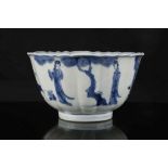 A CHINESE BLUE AND WHITE RIBBED BOWL.
Qing Dynasty, Kangxi era.
Decorated with figures in a