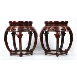 A PAIR OF CHINESE ROSEWOOD BARREL-FORM DRUM STOOLS, ZUODUN.
20th Century.
The solid top panel of