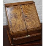 An Edwardian oak correspondence cabinet with two d