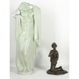 A late Art Deco green glazed figure of a posing nu