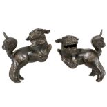 A PAIR OF CHINESE BRONZE BUDDHIST LION DOGS.
17th Century.
Standing on hind legs with the tail
