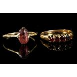 A boxed 9ct gold ladies ring set with five rubies,