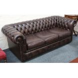 A brown leather button upholstered Chesterfield so