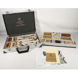 A boxed 'Bestecke' company canteen of gold plated cutlery made in West Germany. In mint unused