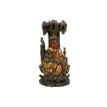 A CHINESE LACQUERED WOOD CARVING OF A GUANYIN AND