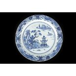 A LARGE CHINESE BLUE AND WHITE CHARGER. 

Qing Dynasty, c. 1800. 

The central roundel painted