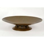 A NELSON ART NOUVEAU HAMMERED COPPER DISH, circa 1920, oval form raised on a stylised foot,