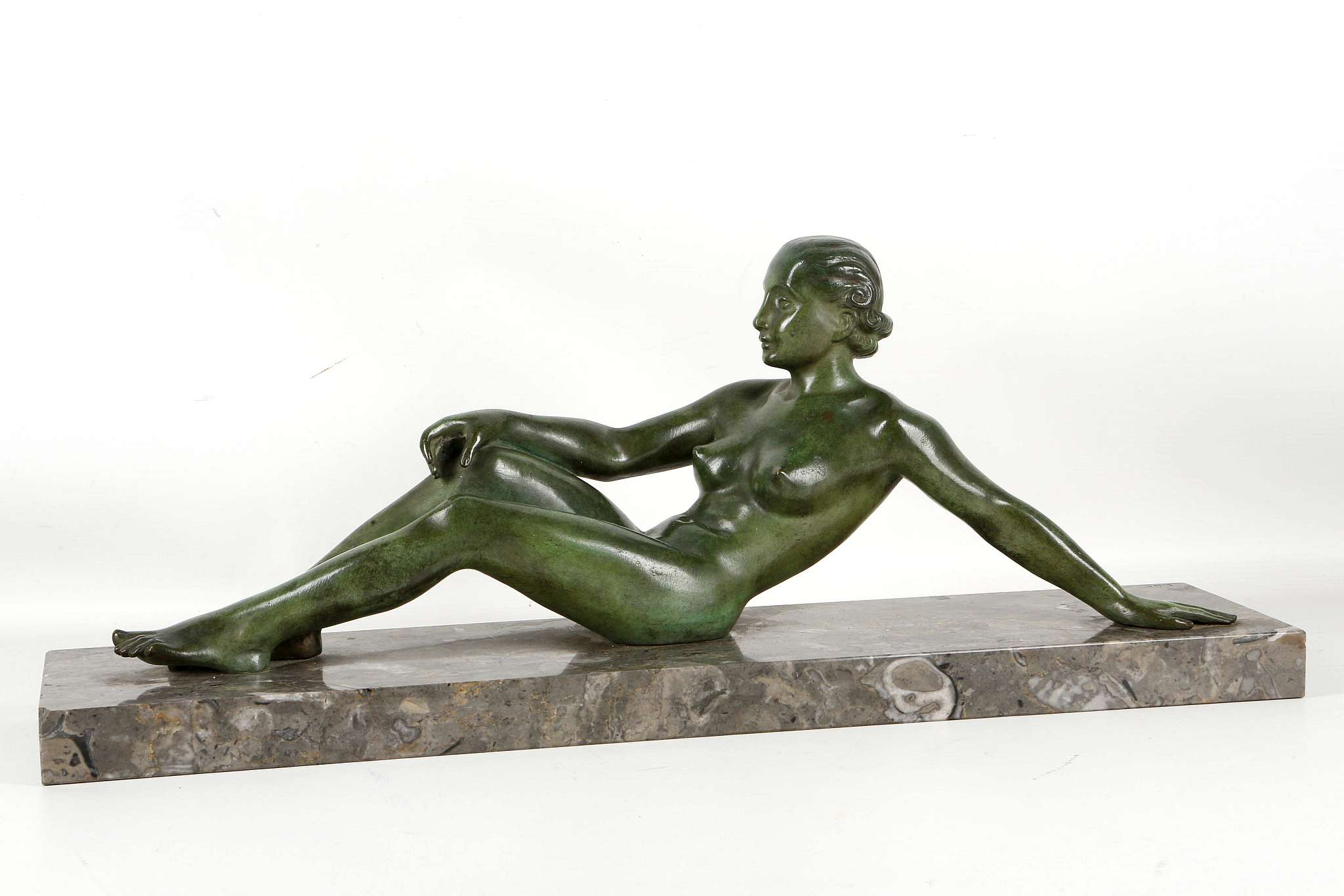 A 1930's ART DECO FEMALE RECLINING NUDE BRONZE SCULPTURE, in the manner of Marcel-Andre Bouraine, on