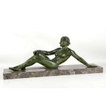 A 1930's ART DECO FEMALE RECLINING NUDE BRONZE SCULPTURE, in the manner of Marcel-Andre Bouraine, on