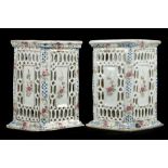 A PAIR OF FAMILLE ROSE BRUSH POTS.
Late Qing.
Of rectangular section with openwork panels, zheng