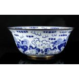 A LARGE CHINESE BLUE AND WHITE BOWL. Late Qing. The exterior and interior decorated with Buddhist