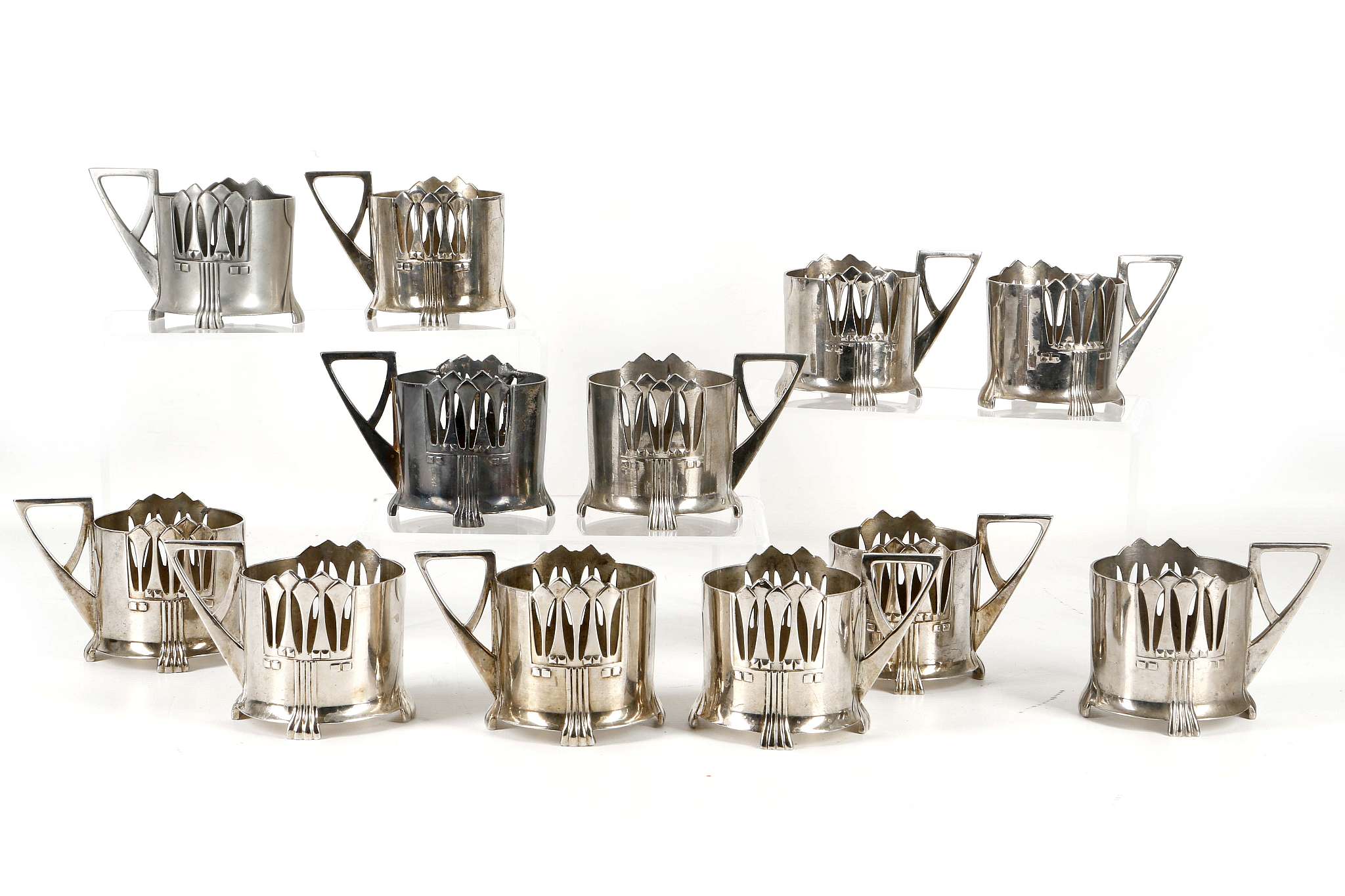 WMF JUGENDSTIL TEA GLASS HOLDERS, CIRCA 1906, set of twelve, stamped with makers marks under and