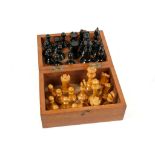 An early 20th century boxwood and ebonised chess s