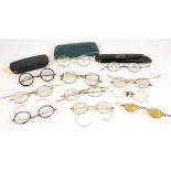 A collection of 11 pairs of early spectacles, some