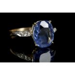 An 18ct gold sapphire ring with diamond set should