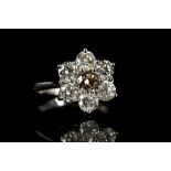 An 18k white gold, 7 stone diamond cluster ring, t