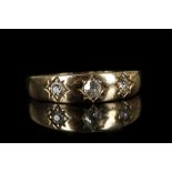 An 18ct gold and diamond set three stone ring