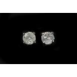 A pair of 18k white gold diamond stud earrings, to