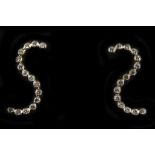 A pair of 18ct gold and diamond set S scroll earri