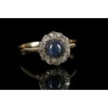 An 18ct yellow gold cabouchon set sapphire and dia