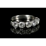 A platinum and diamond 5 stone half eternity ring,