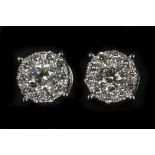 A pair of 18k white gold, screw back multi cluster