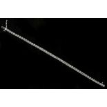 A 14k white gold diamond line bracelet, total diam