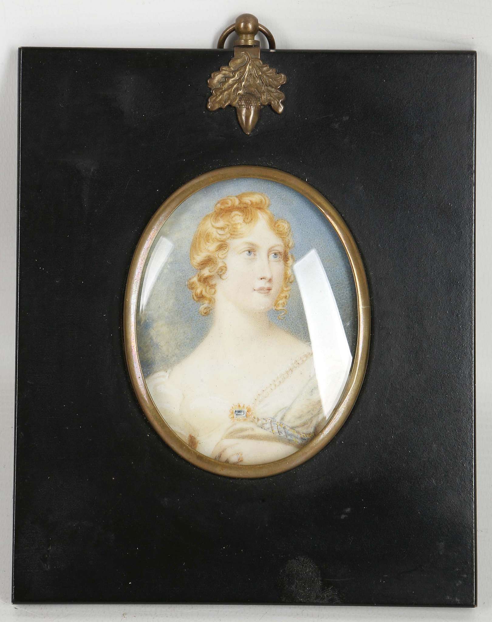 A mounted portrait miniature of a lady.