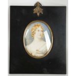 A mounted portrait miniature of a lady.