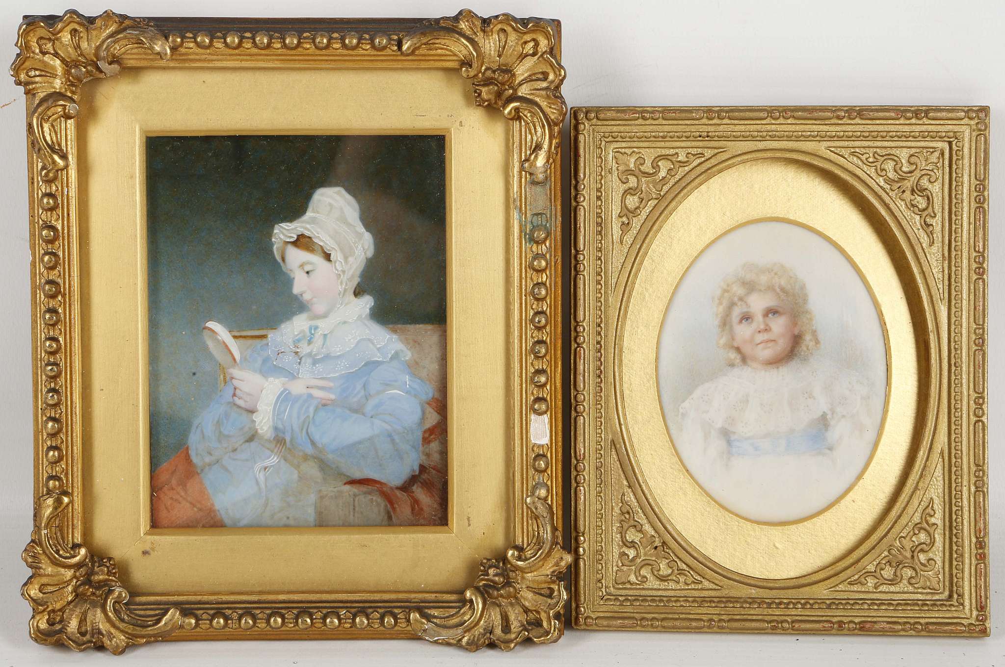 A pair of gilt mounted portrait miniatures, a girl in a lace bonnet and another of an infant. (2).