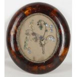 An oval framed 3 dimensional jewelled posy in gilt crystal semi precious stones, 37cm high. Sold