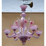 A mid 20th century Murano chandelier in pink mottled glass with gold inclusions and having 6