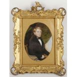 A gilt mounted portrait miniature of a gentleman seated.