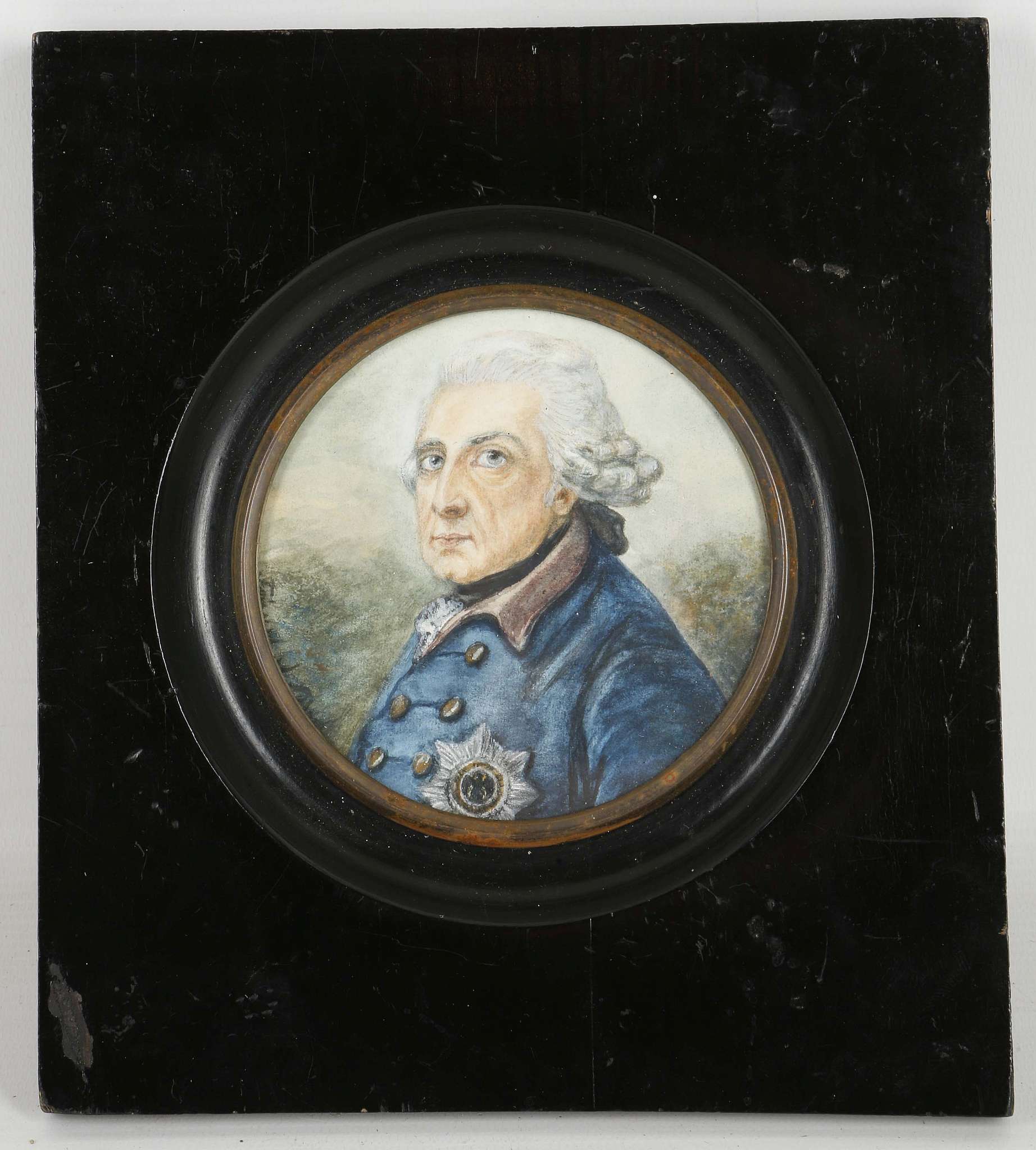 A circular, mounted portrait miniature of Frederick the Great.