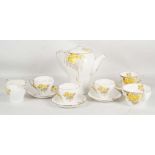 A 1950's  Shelley part coffee set, pattern no. 823343, featuring a yellow flower design. Lot