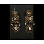 A pair of 19th Century Sicilian gold an pearl set filigree pendant earrings.