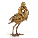 A Bergman style Vienna bronze, modelled as a baby riding a stork. 10cm.