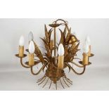 An early 20th century ceiling light, gilded bushell of corn surrounded by 8 branch lamps. 48cm