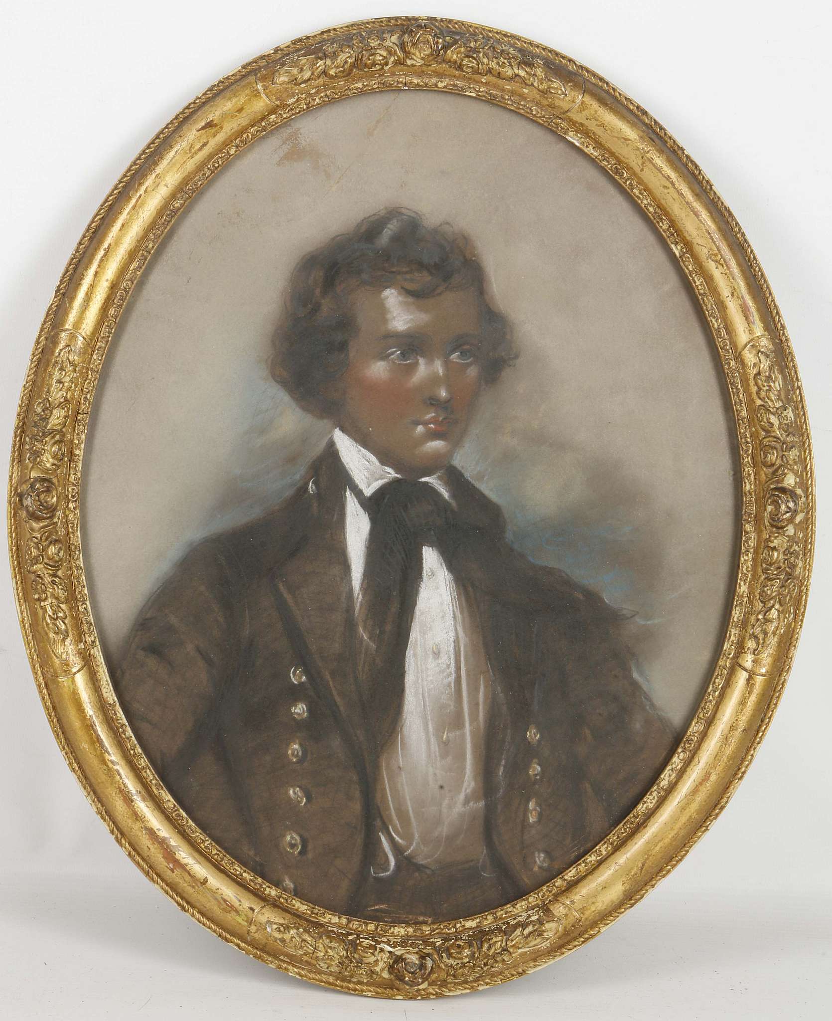 A large framed oval pastel portrait of a young naval gentleman (Charles T.C. Grant), 38.5cm x 30.