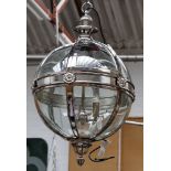 A chrome and glass 'Mitre form' pendulus wall light.