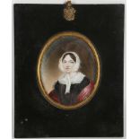 A mounted portrait miniature of a lady wearing a headscarf.