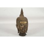 A small 29th century, Kingdom of Siam bronze Buddh